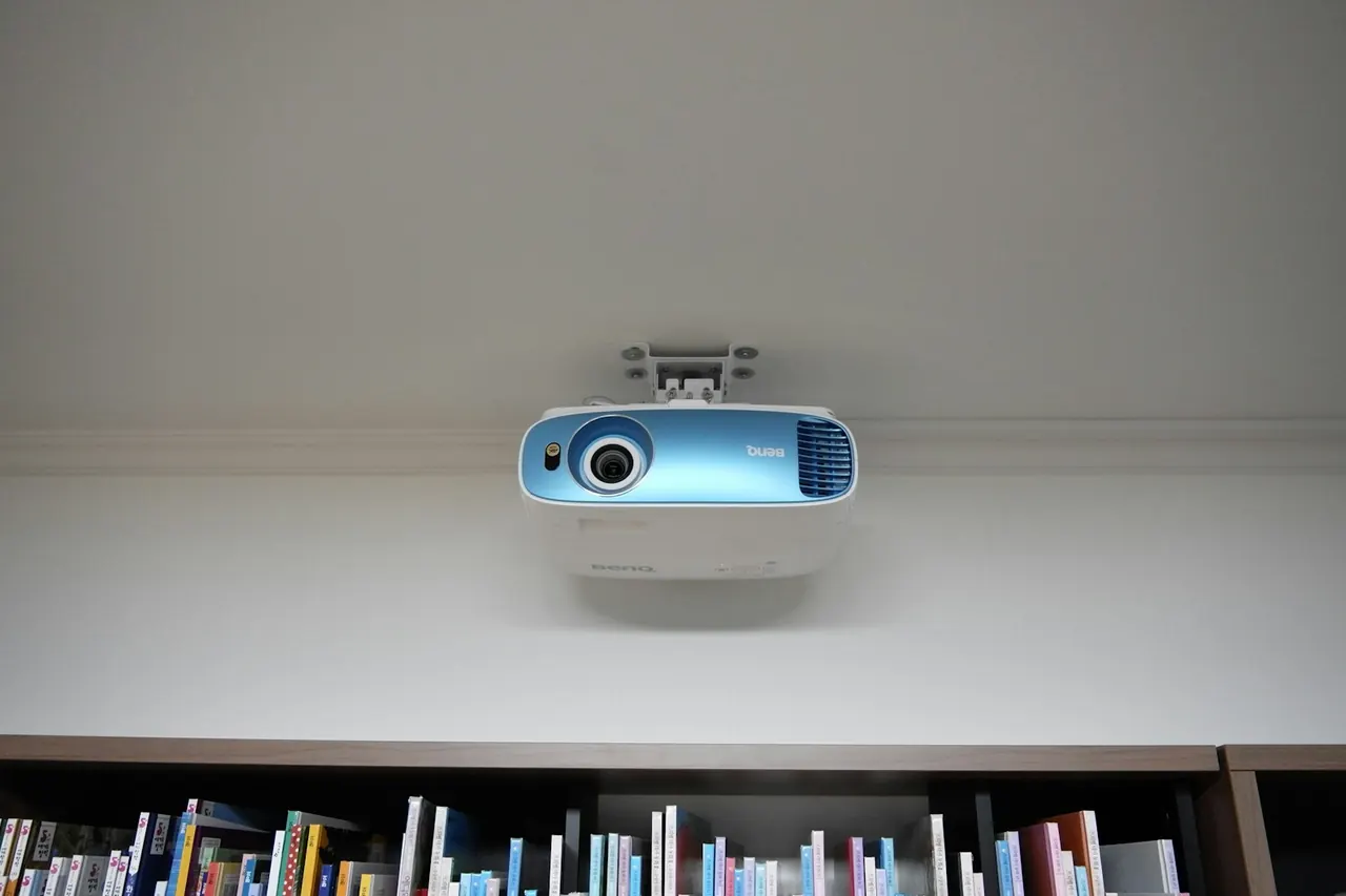 Projector mounted on a ceiling bracket
