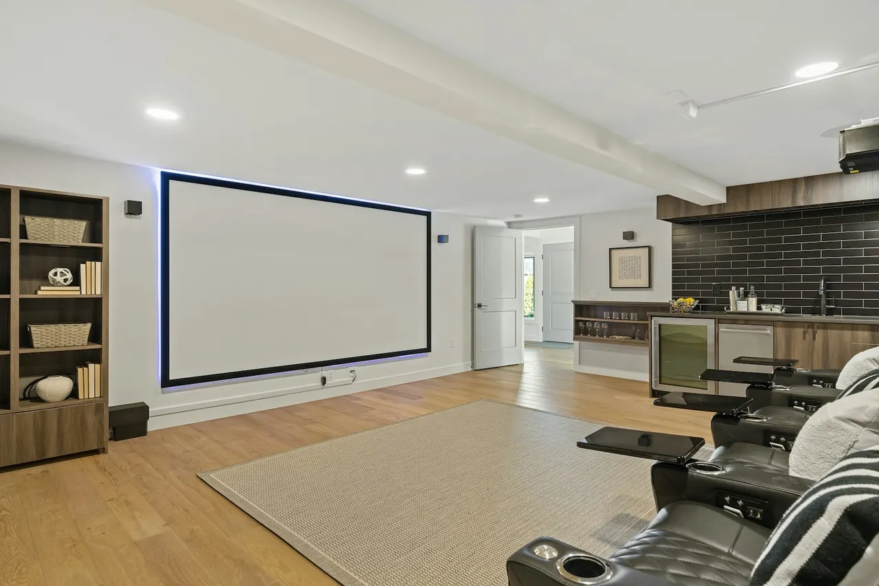 Living room with a wall-mounted projector screen