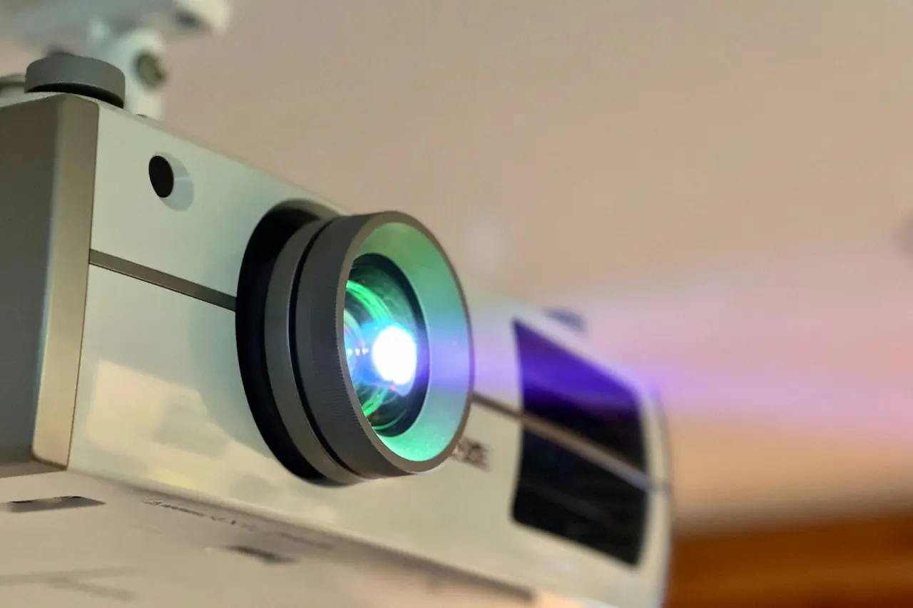 Close-up of a projector lens during projector service
