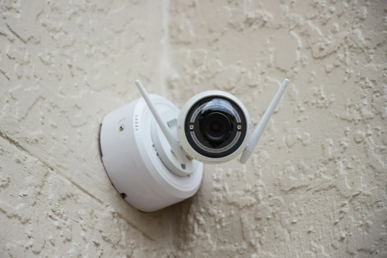 Wi-Fi security camera mounted on a house wall